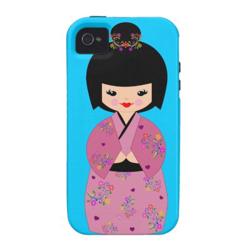 Boneca de Kokeshi em um quimono floral na caixa az