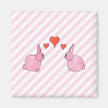 Coelhos cor-de-rosa com corações imas