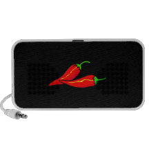 Duas pimentas de pimentão vermelho no lado caixinhas de som para iPhone