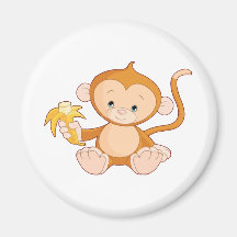 Macaco do bebê com banana imãs