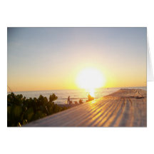 Passeio à beira mar da praia do por do sol cartão