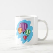 Quatro balões de ar quente coloridos caneca
