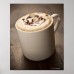 Uma caneca de café do Cappuccino cobriu com derret Posters
