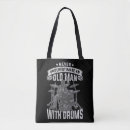 Pesquisar por music tshirts bolsas Música