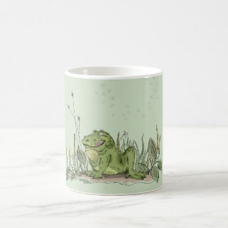 A caneca com imagem engraçada do sapo verde
