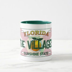 A caneca da placa de matrícula da Villages Florida