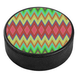 A circular speaker with a vibrant, zigzag pattern