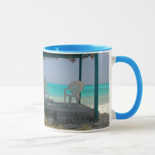 A ilha Bahamas do gato deve ter a caneca (Direita)