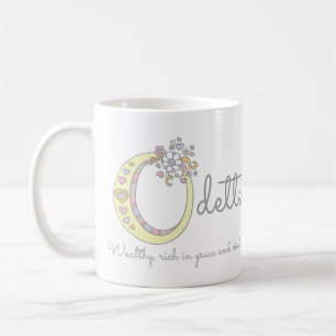 A ODETTE rotula o nome decorativo de O com caneca