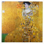 A Senhora do Dourado, Gustav Klimt<br><div class="desc">Gustav Klimt (14 de julho de 1862 - 6 de fevereiro de 1918) era um pintor simbólico austríaco e um dos membros mais destacados do movimento Viena Secessão. Klimt é notado por suas pinturas, murais, esboços, e outros objetos de arte. Além de suas obras figurativas, que incluem alegorias e retratos,...</div>