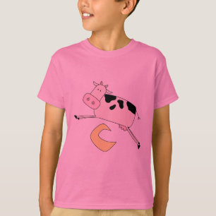 A vaca salta sobre o camiseta e os presentes da