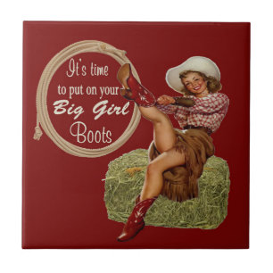 A vaqueira ocidental do vintage pôr sobre botas
