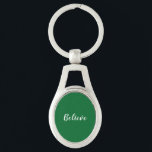 Acredite em Chaveiro<br><div class="desc">Chaveiro de metal com fundo verde escuro e texto branco.</div>