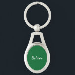 Acredite em Chaveiro<br><div class="desc">Chaveiro de metal com fundo verde escuro e texto branco.</div>