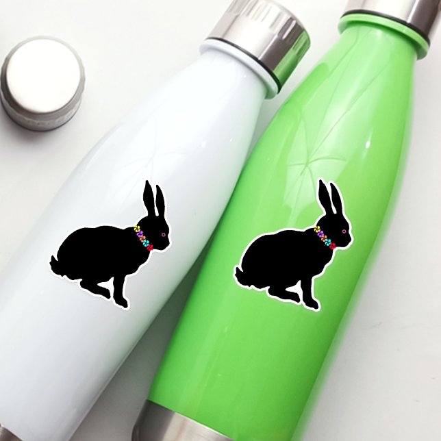 Adesivo Anel de Coelho de Silhueta Preta primavera de Flor (Sitting spring time or Easter black silhouette rabbit wearing colourful flowers on vinyl sticker.)