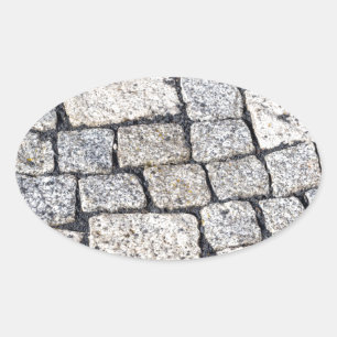 Adesivo Oval Pedras de uma rua em detalhes