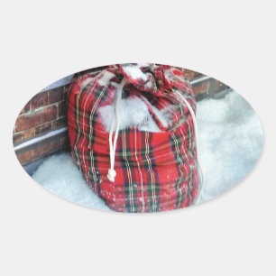 Adesivo Oval Santa Claus Bag na neve