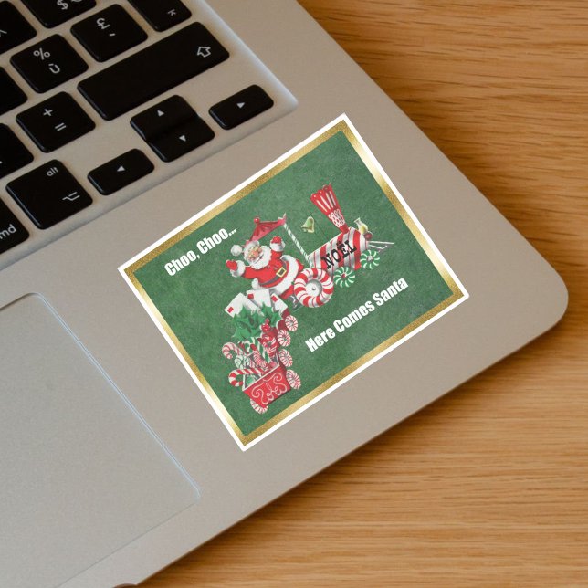 Adesivo Papais noeis sobre os doces de trem de Natal - fro (Santa Riding Christmas Train Candy canes, letters on green with gold border vinyl sticker.)
