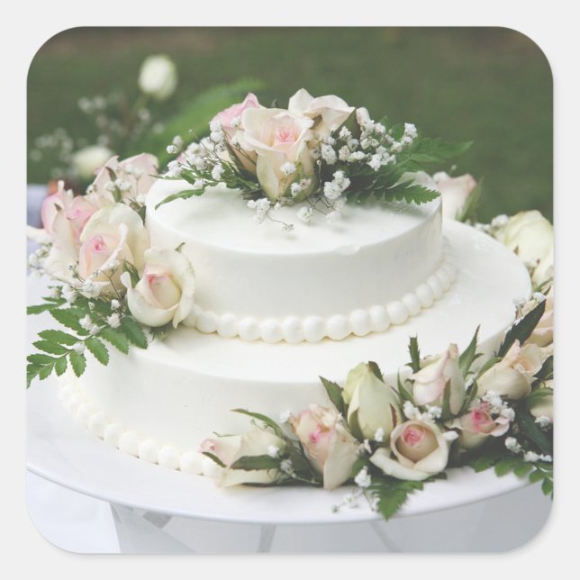 Adesivo Quadrado Bolo de Casamento (A beautifully decorated wedding cake adorned with delicate roses and greenery.  )