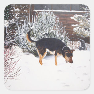Adesivo Quadrado Cena da neve do inverno com o cão preto e tan