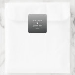 Adesivo Quadrado Elegante Gratidão Cinza<br><div class="desc">Este adesivo de casamento apresenta um design minimalista com um fundo cinza gradiente, transitando de claro para escuro. O layout é limpo e equilibrado, apresentando dois nomes em tipografia serifada elegante conectados por um e comercial, seguido por um simples "obrigado" em uma fonte sans-serif contrastante. A paleta de cores em...</div>