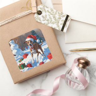 Adesivo Quadrado Greyhound correndo em neve com chapéu de Natal