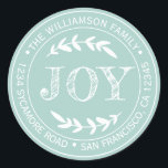 Adesivo Redondo Alegria Moderna de Natal Rústico Endereço de Devol<br><div class="desc">Adesivo de endereço de devolução redondo de Natal com o seu nome e endereço em tipografia branca estilosa, apresenta o texto ALEGRIA em tipografia manuscrita com um toque estiloso de folhagem rústica em um fundo azul pastel. Basta adicionar o seu nome e endereço. Exclusivamente projetado para você pelo Happy Dolphin...</div>