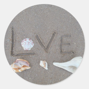 Adesivo Redondo Amor na praia com escudos do mar