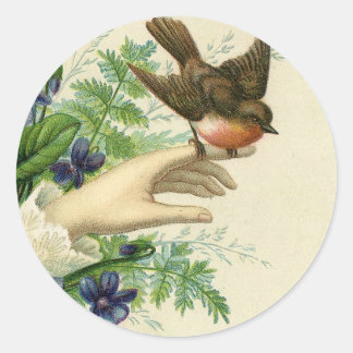 Adesivo Redondo Beautiful hand with a bird and flowers