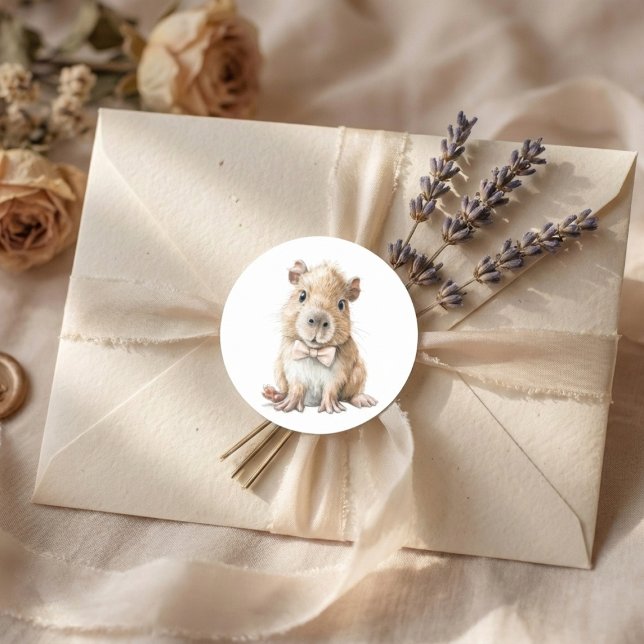 Adesivo Redondo Capybara Baby Shower  (soft neutral sticker with baby capybara bow tie on beige envelope with lavender accents)