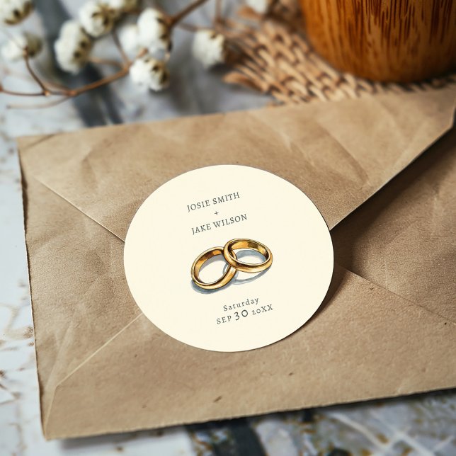 Adesivo Redondo Casamento de alianças mudas (Delicate gold rings on a muted background sticker, evoking elegance and serene romance for weddings.)