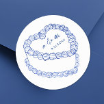 Adesivo Redondo Casamento Whimsical Azul De Bolo De Vintagem Desen<br><div class="desc">Vintage Cake Casado com Vintage. Estes adesivos de casamento redondos personalizados apresentam uma simples ilustração do bolo no estilo vintage no centro, realçados com detalhes elegantes azuis e revestidos com as iniciais do monograma do casal e a data do casamento para um toque eterno e sofisticado. O design minimalista mostra...</div>