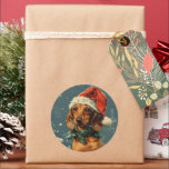 Adesivo Redondo Dachshund Christmas<br><div class="desc">Compartilhe a alegria de férias com um charmoso cartão de Natal com um adorável Dachshund fazendo um chapéu festivo de Papai Noel. A expressão alegre do filhote e o toque caprichoso do chapéu trazem calor e alegria ao cartão. Perfeito para espalhar sorrisos e cumprimentos sazonais, este cartão captura o espírito...</div>