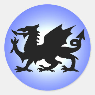 Adesivo Redondo Dragão voado preto de Wales contra o céu azul Su