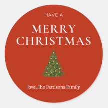 Feliz Natal saudando a árvore de costume vermelho