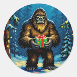 Adesivo Redondo Funny Bigfoot holding a Christmas Gift