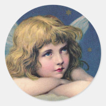 Heavenly angel daydreaming on a cloud in the sky