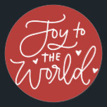 Adesivo Redondo Joy To The World Lettering Red Christmas<br><div class="desc">Alegria ao mundo,  o Senhor vem! Adicione um sotaque festivo aos seus envelopes,  cartões e presentes com este adesivo de férias. Apresenta caligrafia moderna com fundo vermelho. Este adesivo de Natal é perfeito como um selo de envelope e para embalagem de presente.</div>