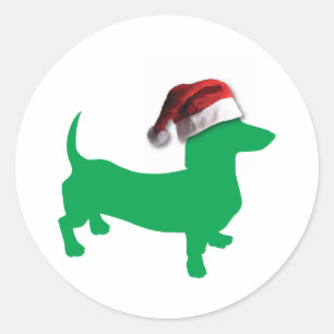 Adesivo Redondo Luz - Dachshund verde com um chapéu de Papai Noel
