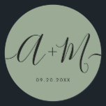 Adesivo Redondo Minimalist Monogram Script Custom green Wedding<br><div class="desc">Elevate your wedding details with the Minimalist Monogram Script Custom Wedding Date green Sticker. This elegant and personalized sticker adds a touch of sophistication to your wedding stationery, allowing you to showcase your monogram and wedding date in a simple yet impactful way. The sticker features a minimalist script design that...</div>