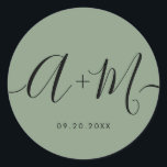 Adesivo Redondo Minimalist Monogram Script Custom green Wedding<br><div class="desc">Elevate your wedding details with the Minimalist Monogram Script Custom Wedding Date green Sticker. This elegant and personalized sticker adds a touch of sophistication to your wedding stationery, allowing you to showcase your monogram and wedding date in a simple yet impactful way. The sticker features a minimalist script design that...</div>