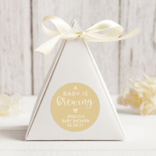 Adesivo Redondo Minimalista Um Bebê está criando um favor para o C