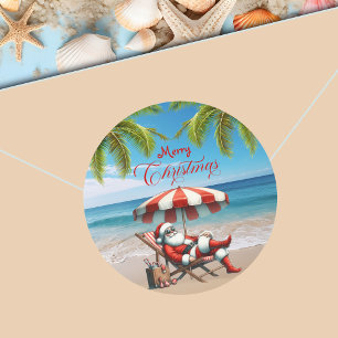 Adesivo Redondo Natal com Papai Noel sob um Guarda-Chuva de Praia