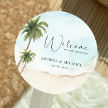 Adesivo Redondo Palm Trees Beach Destination Wedding Welcome<br><div class="desc">Celebre o seu casamento com estes adesivos bonito,  com palmeiras de aquarela e o seu texto personalizado. Adicione facilmente seus próprios detalhes clicando na opção "personalizar".</div>