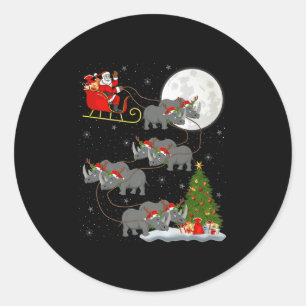 Adesivo Redondo Papai Noel de Rinoceronte Voando Magicamente Natal
