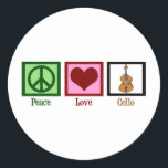 Adesivo Redondo Peace Love Cello<br><div class="desc">Um belo presente de natal cello para o cellista de excelentes em sua vida. Este design de Peace Love Cello apresenta um sinal de paz bonito,  coração,  e o instrumento musical,  o violoncelo. Um presente de excelente para um membro do quarteto de cordas ou condutor de orquestra.</div>