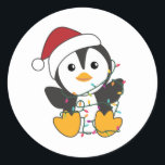 Adesivo Redondo Penguin Christmas Snow Winter Animals Penguins<br><div class="desc">The penguin for Christmas with fairy lights. Funny animals with gifts and snow for the holidays. Also funny for Christmas in July. Penguins are cute animals and perfect for Christmas.</div>