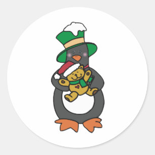 Adesivo Redondo Pinguim Irlandês Segurando Urso de Pelúcia de Nata