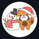 Adesivo Redondo Red Panda With Snowman In Winter For Christmas Cla<br><div class="desc">Red panda with snowman in winter for Christmas - a snowman for winter and Christmas. A winter greeting in the cold season for the holidays. Christmas red panda with snowman.</div>