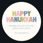 Adesivo Redondo Saudações Coloridas de Hanukkah em Pastel Moderno<br><div class="desc">Celebre a temporada com este alegre design moderno de Hanukkah em um arco-íris divertido de cores pastéis. “Feliz Hanukkah” é apresentado de forma ousada em letras multicoloridas grossas, combinado com uma doce mensagem de amor, luzes e latkes abaixo. A tipografia suave e limpa torna isso perfeito para reuniões festivas, presentes...</div>